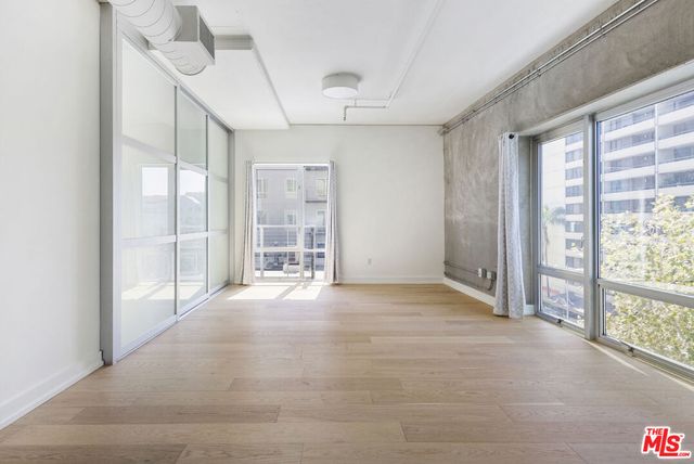 a view of an empty room with a sliding door