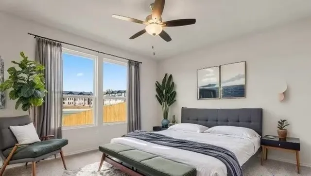 a bedroom with a large bed and a window