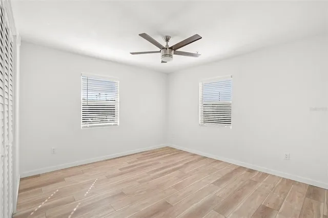 a view of a balcony with wooden floor and iron stairs