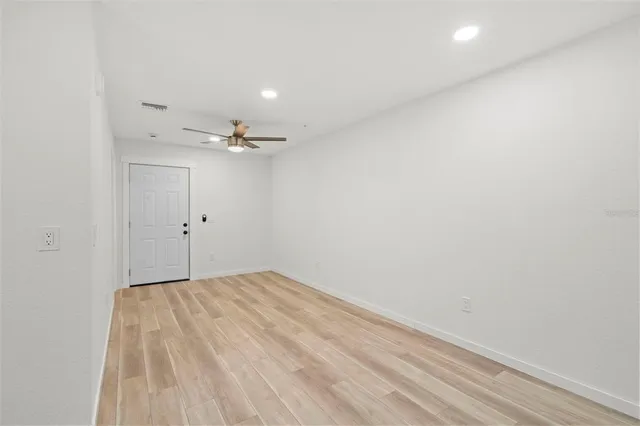 a view of a small space with wooden floor