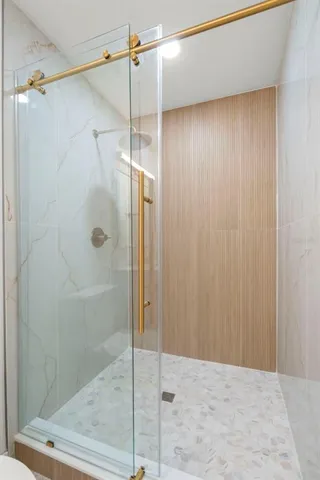 a backyard of a house with a table and chairs