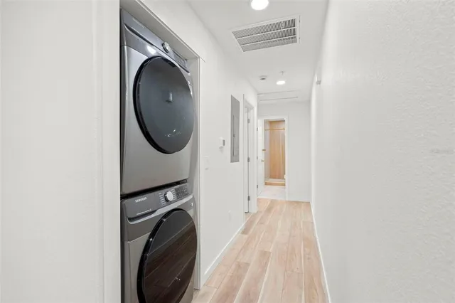 a bathroom with a sink a mirror a toilet and shower