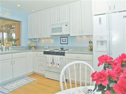 844 Arlene Way Novato, CA 94947 - Photo 2 of 7 a kitchen with granite countertop a white stove top oven sink and cabinets