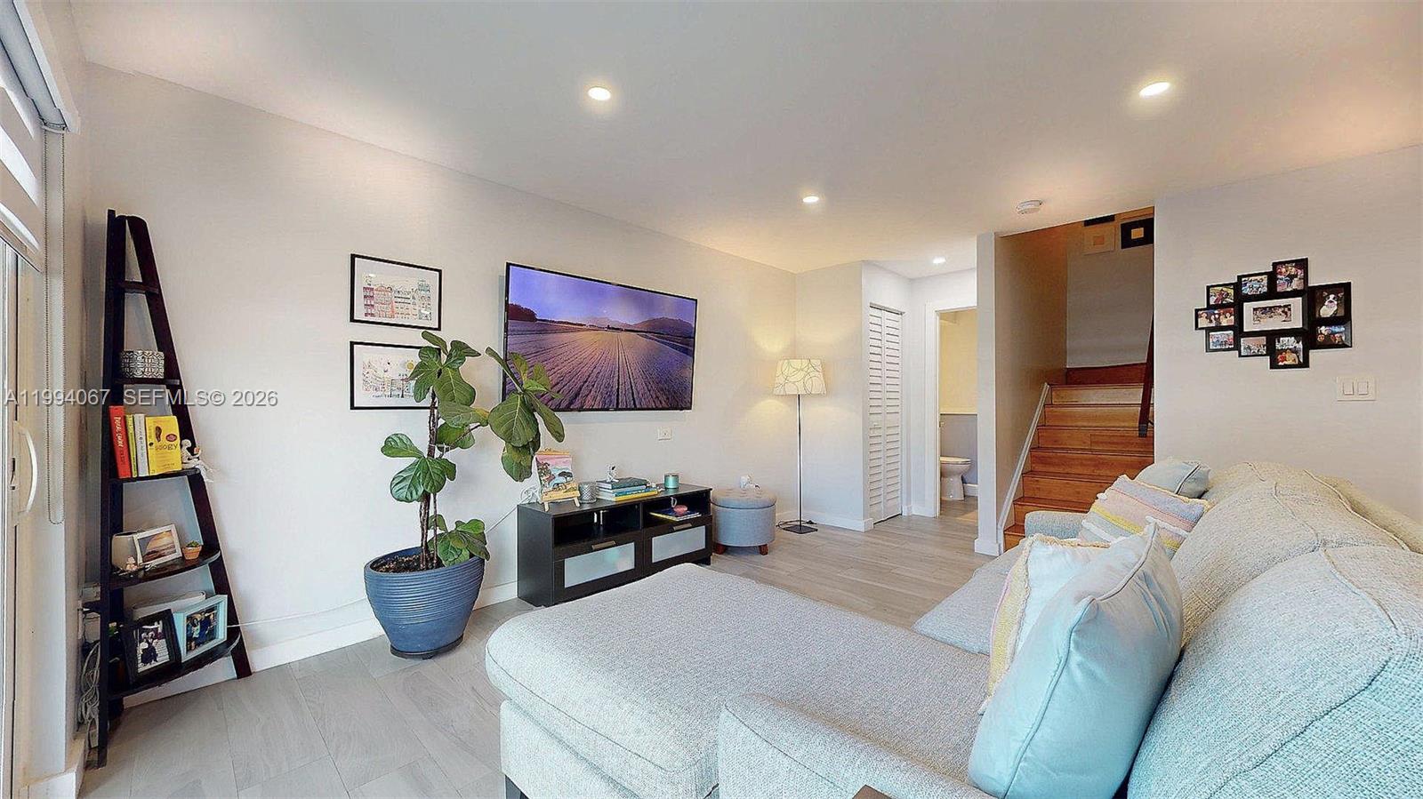 6840 Southwest 45th Lane, Unit 5 Miami, FL 33155 - Photo 12 of 34 a bedroom with furniture and a bed