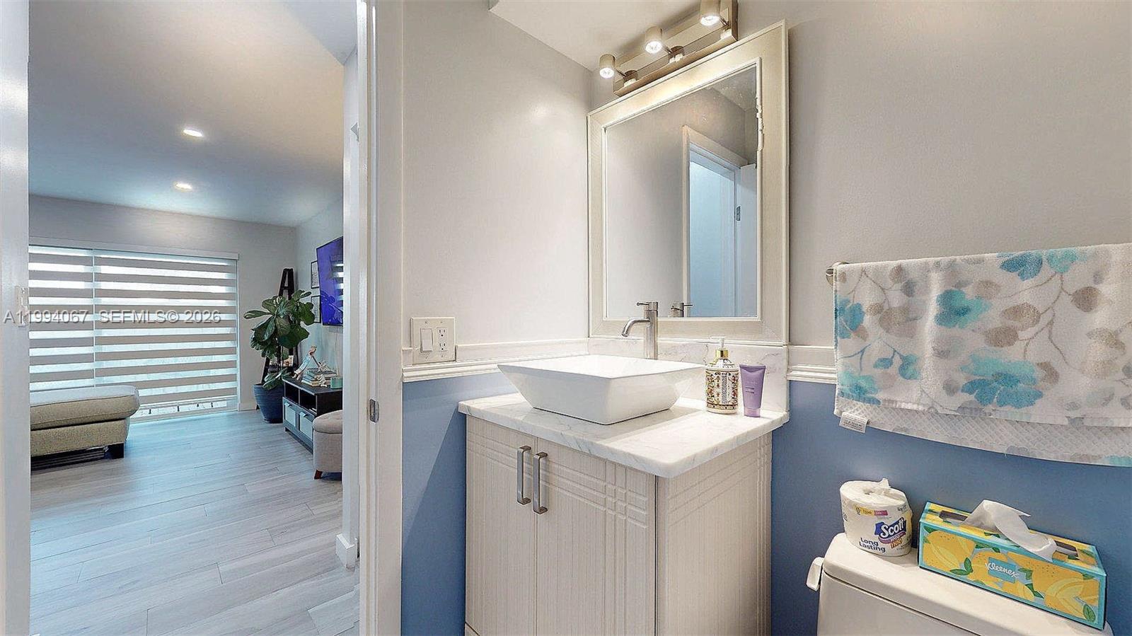 6840 Southwest 45th Lane, Unit 5 Miami, FL 33155 - Photo 20 of 34 a bathroom with a sink vanity and a mirror