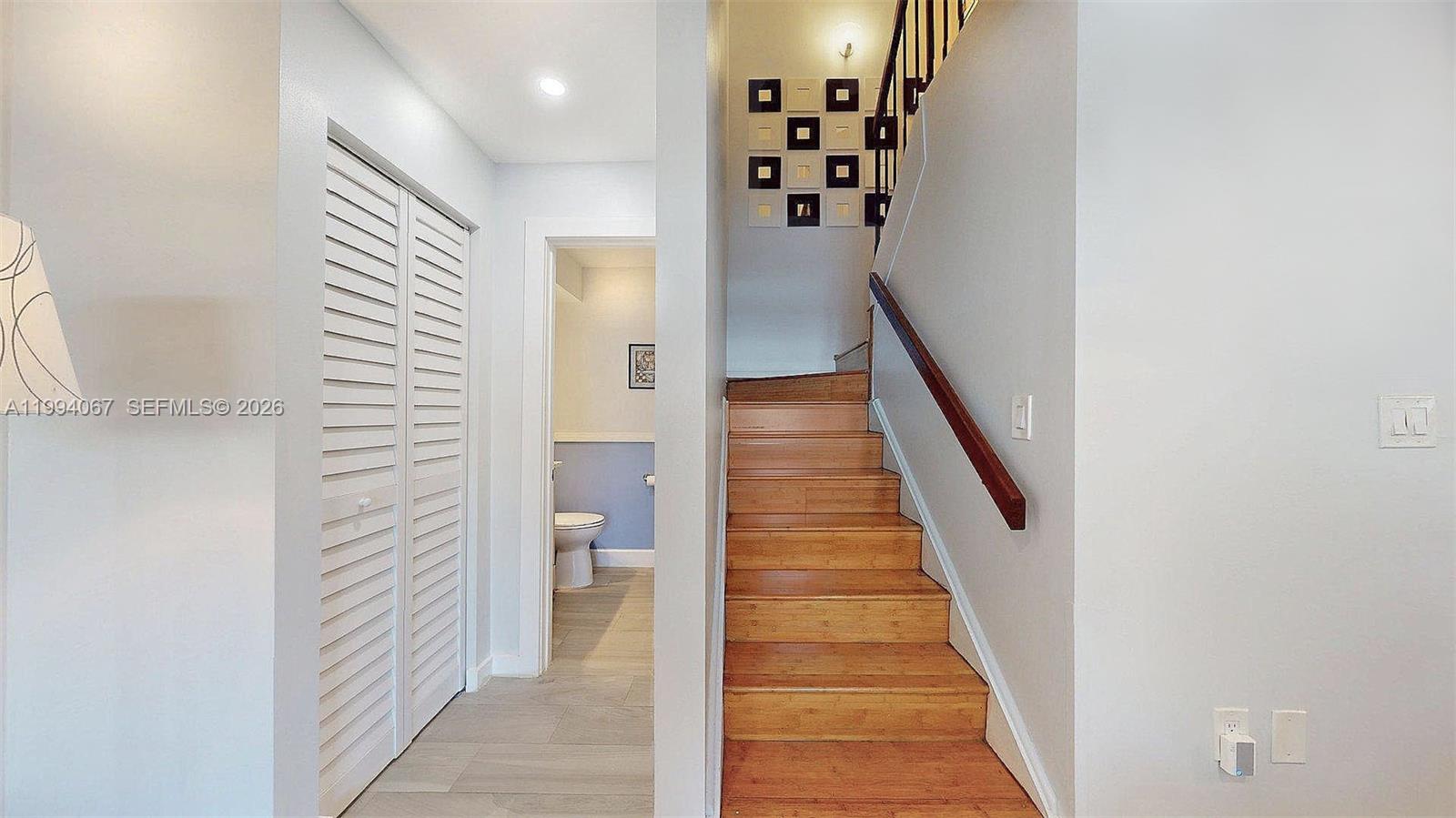 6840 Southwest 45th Lane, Unit 5 Miami, FL 33155 - Photo 24 of 34 a view of a hallway with wooden floor and entryway