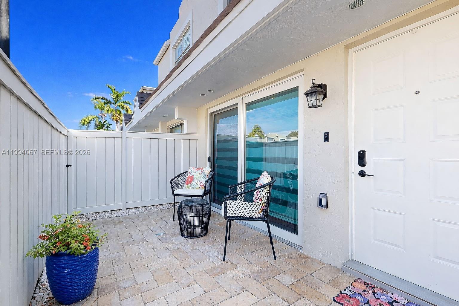 6840 Southwest 45th Lane, Unit 5 Miami, FL 33155 - Photo 3 of 34 a view of a porch with furniture