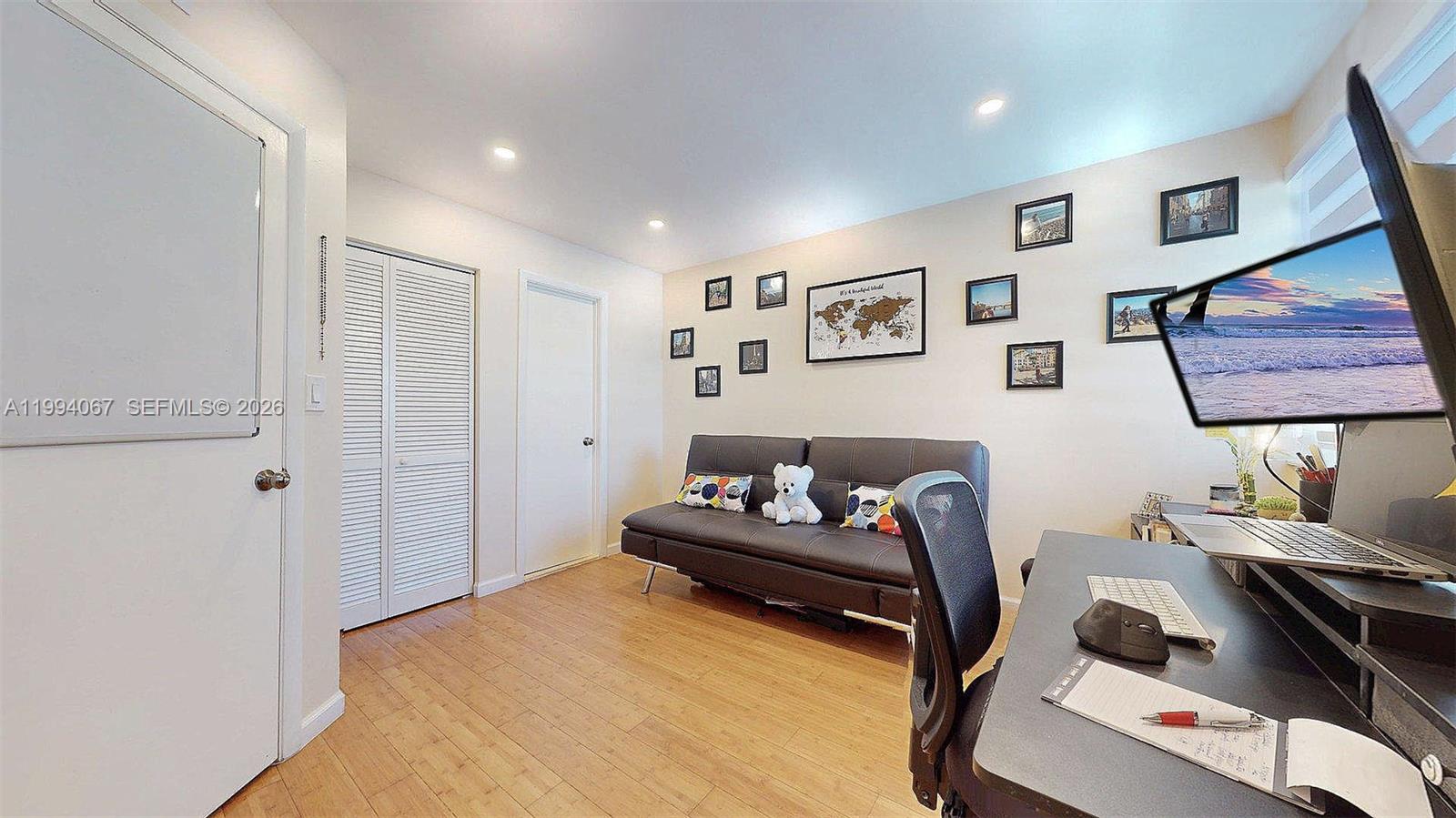 6840 Southwest 45th Lane, Unit 5 Miami, FL 33155 - Photo 31 of 34 a bedroom with a bed and furniture