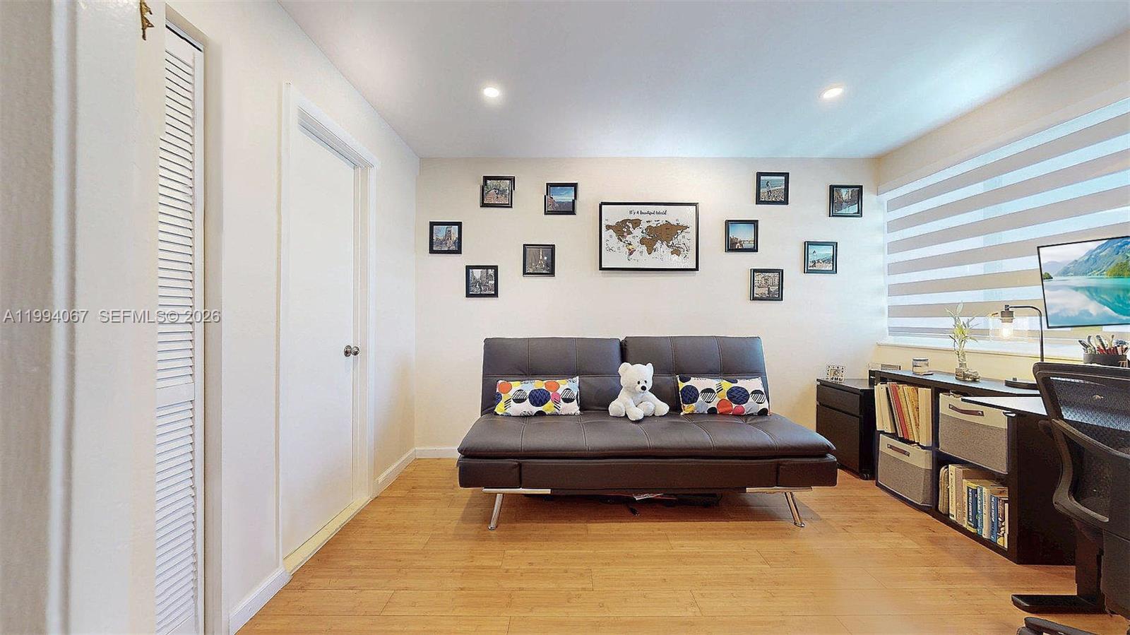 6840 Southwest 45th Lane, Unit 5 Miami, FL 33155 - Photo 32 of 34 a living room with furniture and window