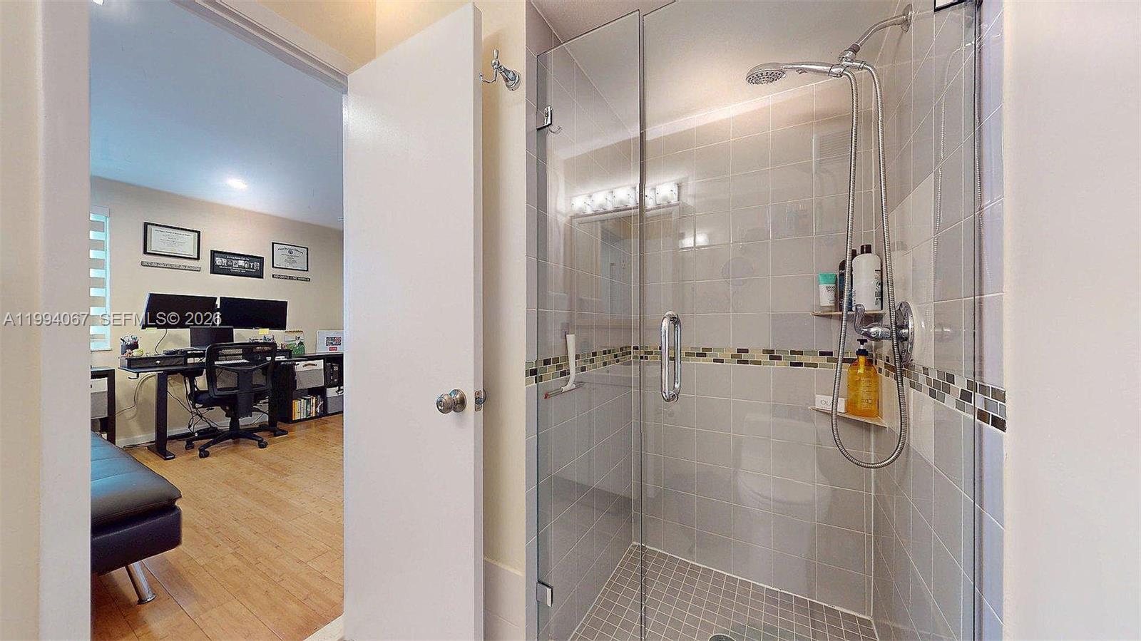 6840 Southwest 45th Lane, Unit 5 Miami, FL 33155 - Photo 33 of 34 a bathroom with a shower