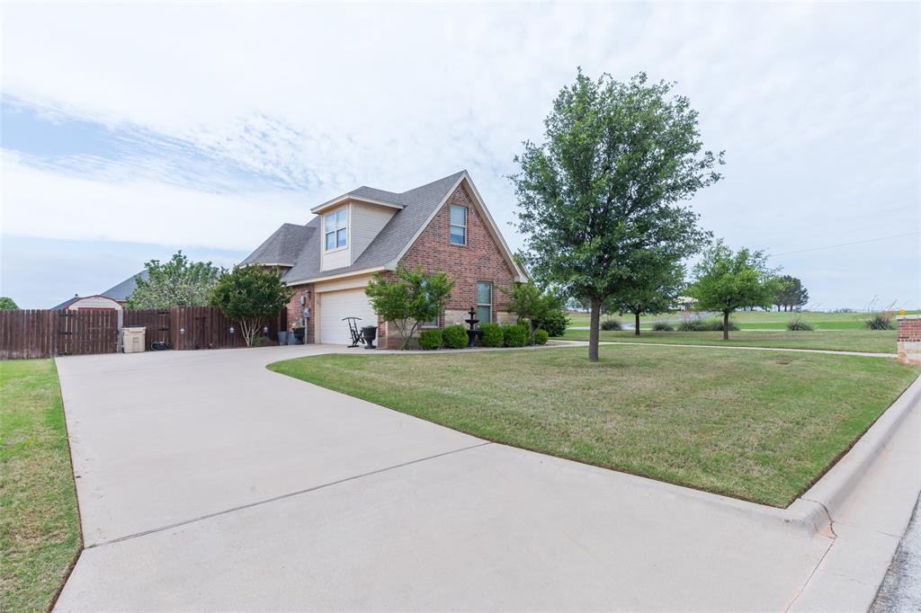 297 Magnum Street Tuscola, TX 79562 - Photo 2 of 35 a front view of a house with a yard