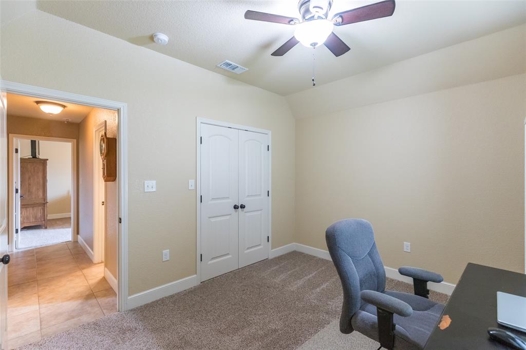 297 Magnum Street Tuscola, TX 79562 - Photo 25 of 35 a view of a workspace with furniture and a chandelier fan