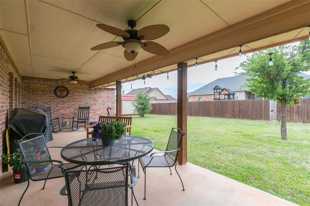 297 Magnum Street Tuscola, TX 79562 - Photo 31 of 35 a view of an outdoor dining space with a table and chairs