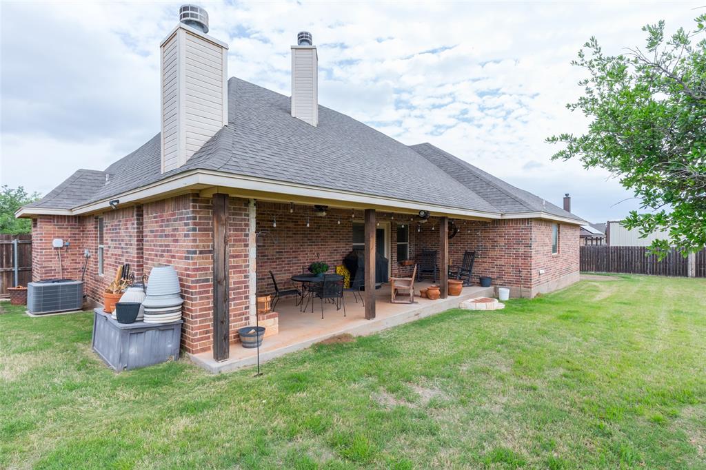 297 Magnum Street Tuscola, TX 79562 - Photo 32 of 35 a front view of a house with table and chairs
