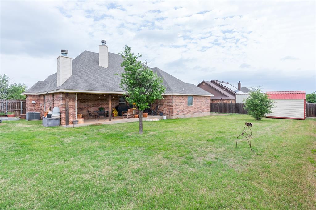 297 Magnum Street Tuscola, TX 79562 - Photo 33 of 35 a view of a house with a yard and table