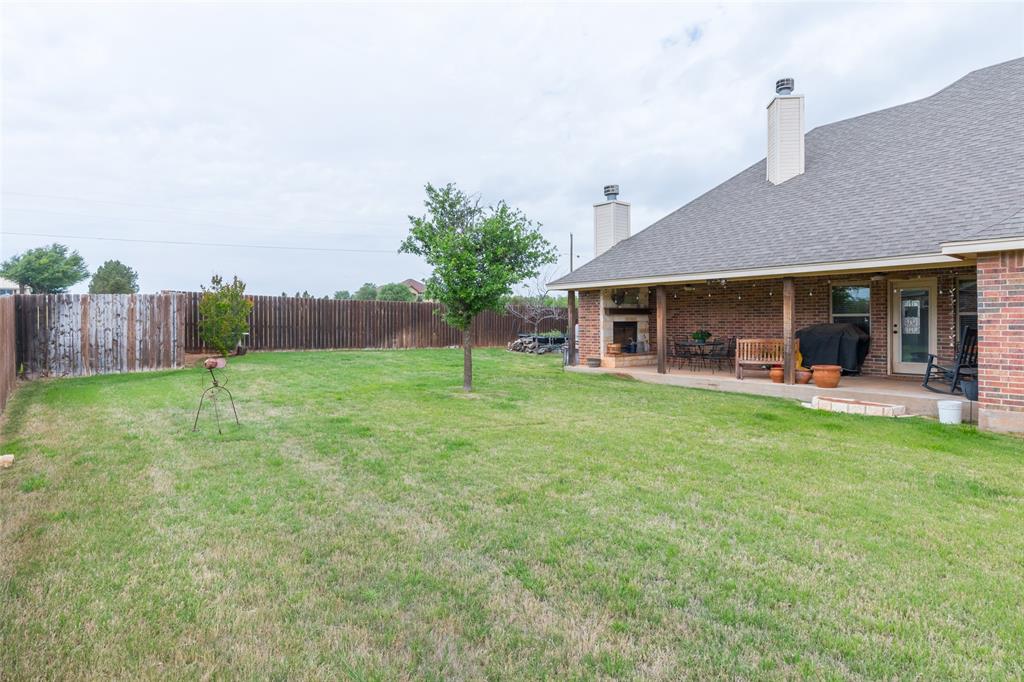 297 Magnum Street Tuscola, TX 79562 - Photo 34 of 35 a view of a house with a yard and sitting area
