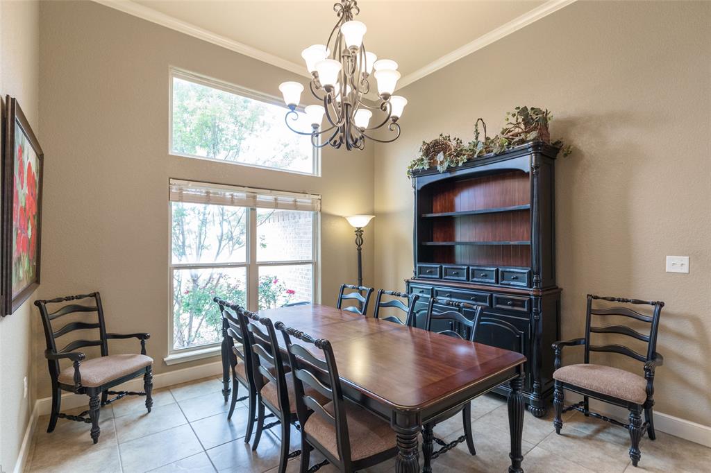 297 Magnum Street Tuscola, TX 79562 - Photo 4 of 35 a dining room with furniture a chandelier and window