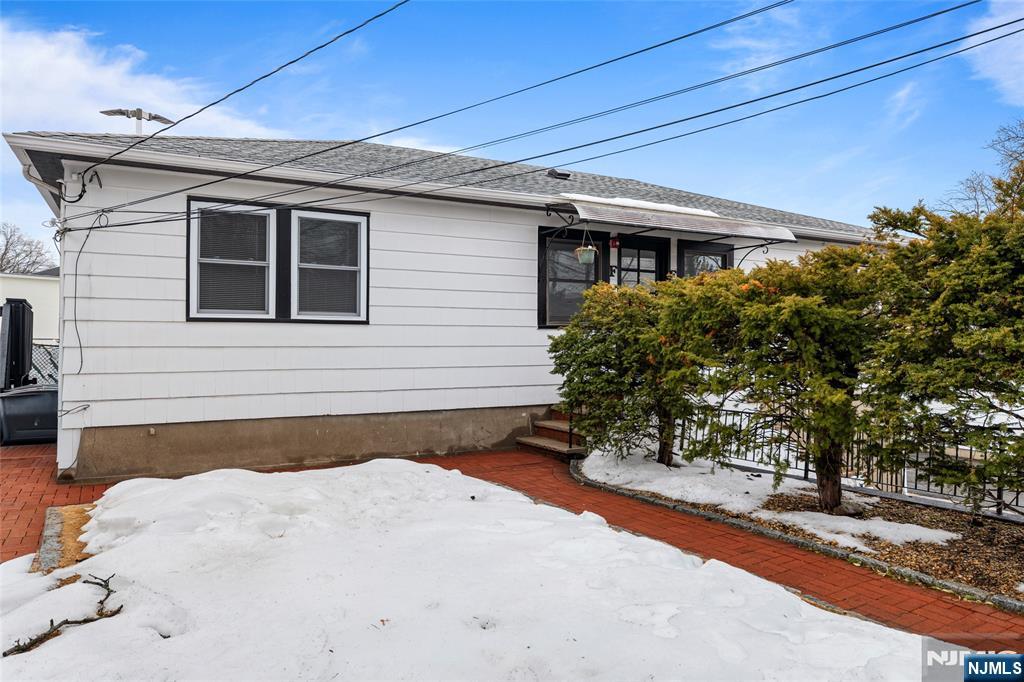 335 Paterson Avenue, Unit F East Rutherford, NJ 07073 - Photo 12 of 12 a front view of a house with a yard