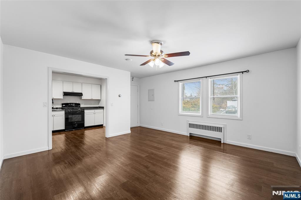 335 Paterson Avenue, Unit F East Rutherford, NJ 07073 - Photo 3 of 12 a view of kitchen with granite countertop a stove and a refrigerator