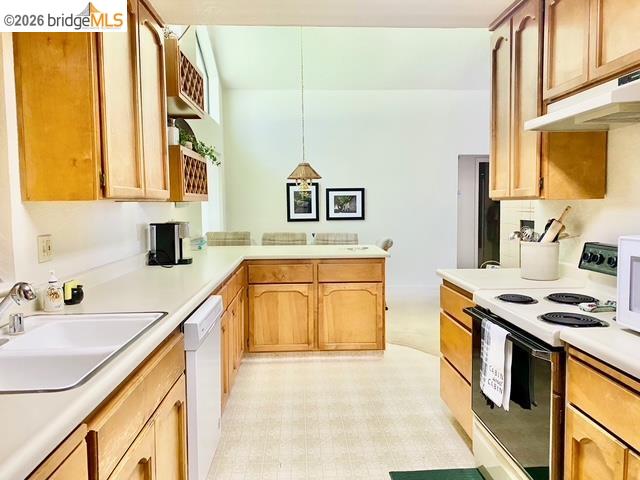 13133 Mohrmann Street Groveland, CA 95321 - Photo 13 of 55 a kitchen with stainless steel appliances a stove a sink and a microwave