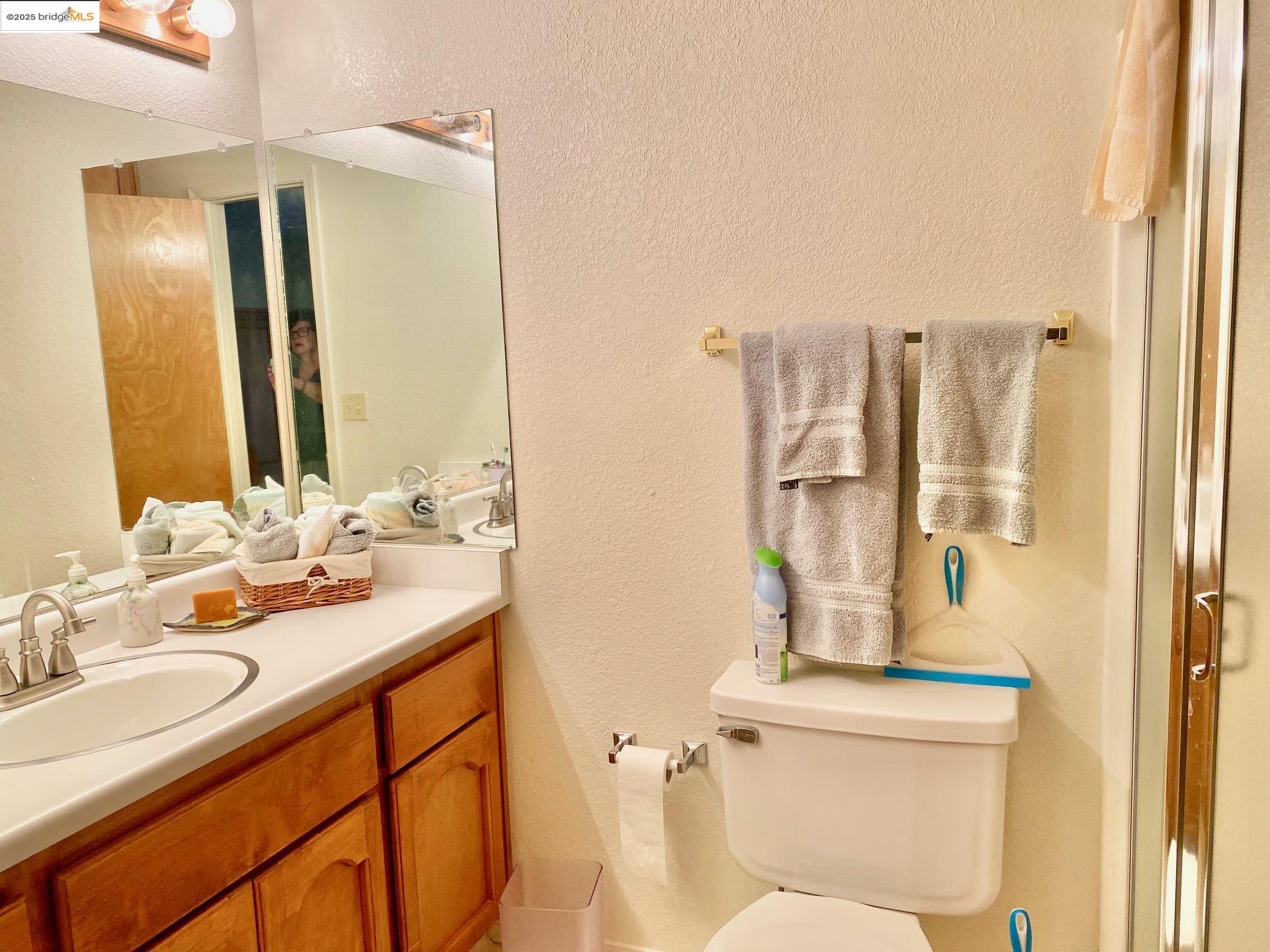 13133 Mohrmann Street Groveland, CA 95321 - Photo 18 of 53 a bathroom with a granite countertop sink toilet and shower