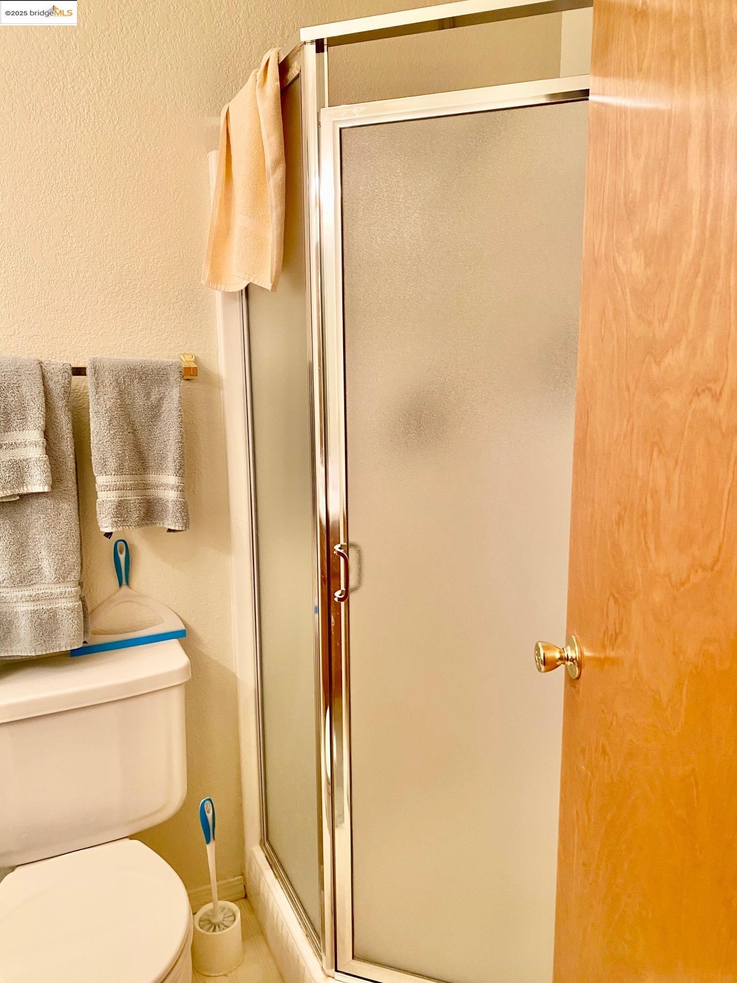 13133 Mohrmann Street Groveland, CA 95321 - Photo 20 of 55 a bathroom with a shower a toilet and a sink
