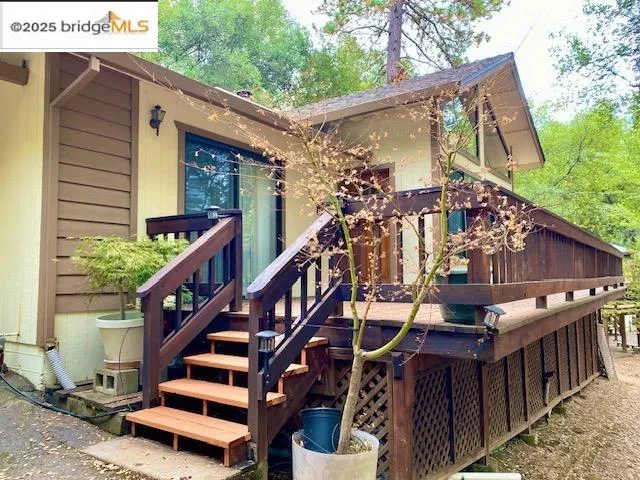 a view of a house with pool and deck