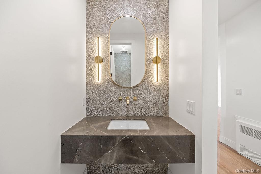 62 Blauvelt Road, Unit 202 Monsey, NY 10952 - Photo 12 of 34 a bathroom with a sink and a mirror