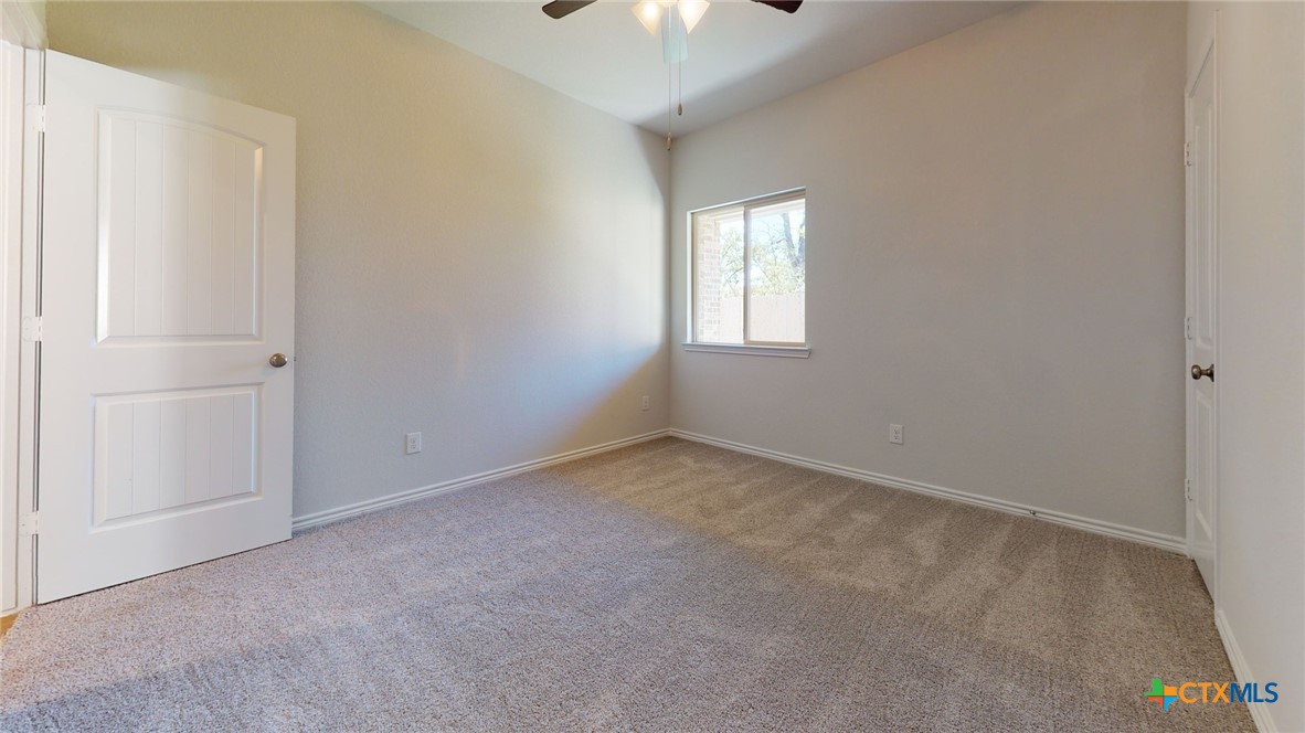 14089 Carsten Loop Salado, TX 76571 - Photo 16 of 17 wooden floor and window in an empty room