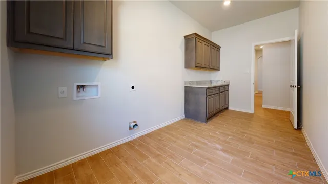 a view of a kitchen with a sink cabinet and a window