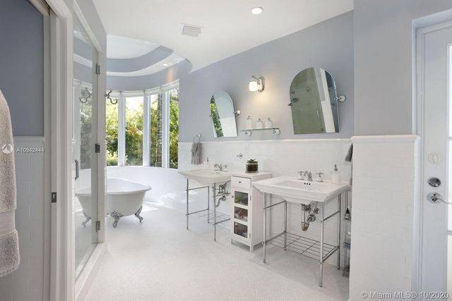 a bathroom with a sink a toilet and bathtub