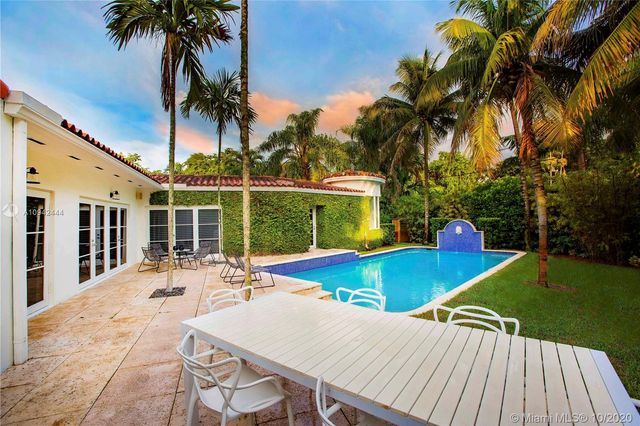 a view of a patio with swimming pool