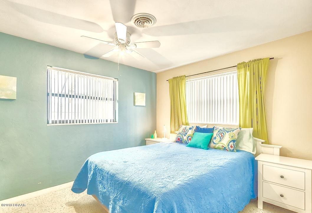 141 Beau Rivage Drive Ormond Beach, FL 32176 - Photo 18 of 34 a bedroom with a bed and window