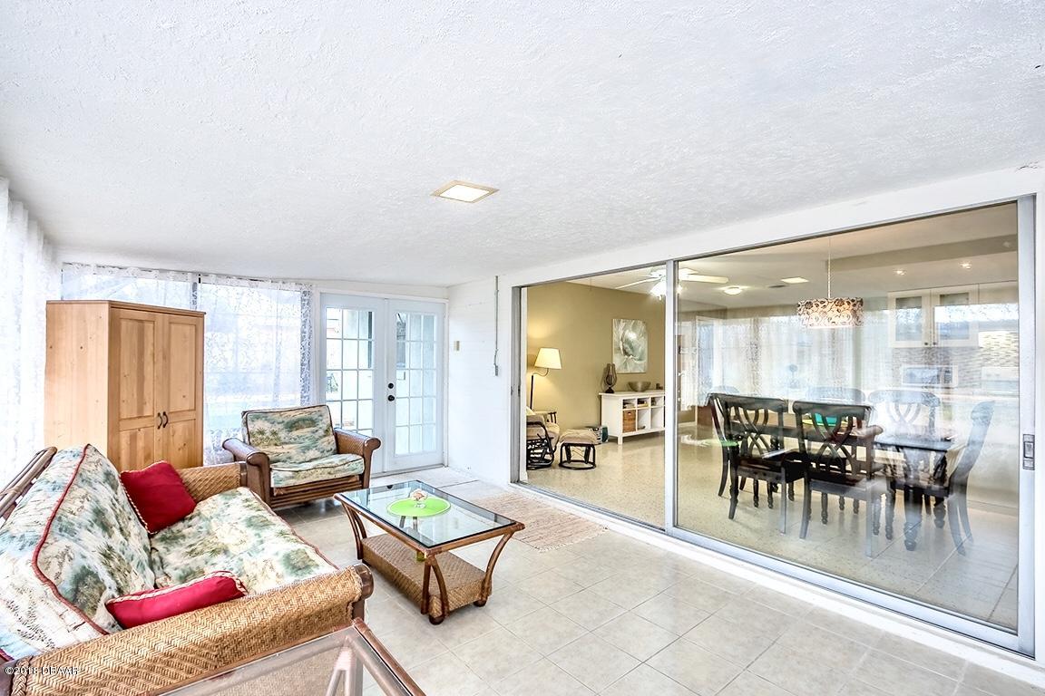 141 Beau Rivage Drive Ormond Beach, FL 32176 - Photo 21 of 34 a living room with furniture and a large window