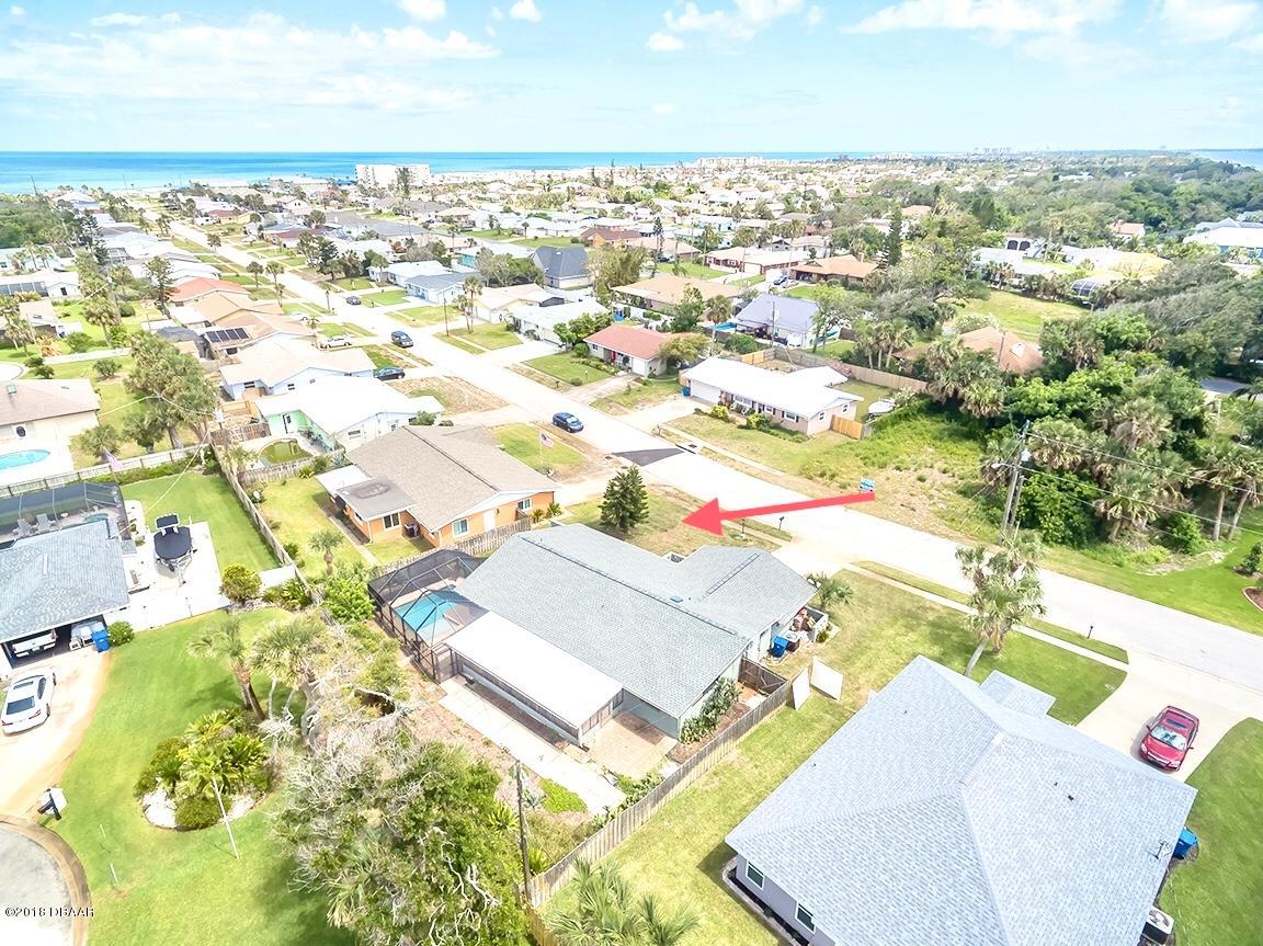 141 Beau Rivage Drive Ormond Beach, FL 32176 - Photo 32 of 34 an aerial view of residential houses with outdoor space