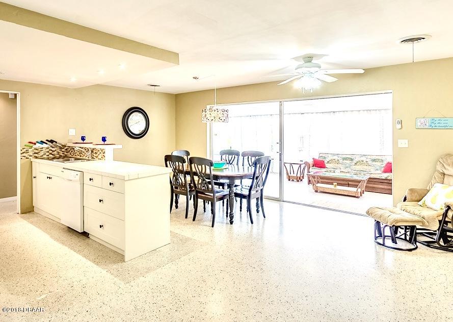 141 Beau Rivage Drive Ormond Beach, FL 32176 - Photo 8 of 34 a living room with furniture and a large window