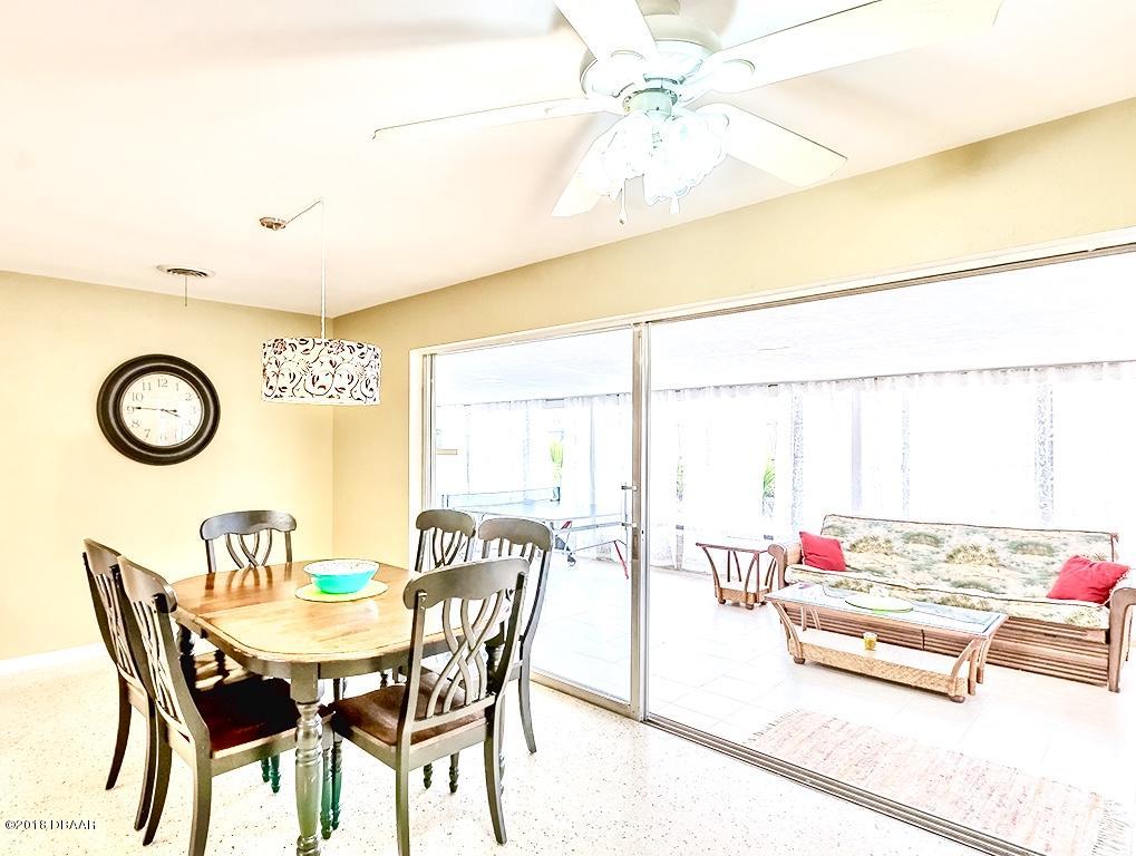 141 Beau Rivage Drive Ormond Beach, FL 32176 - Photo 10 of 34 a view of a dining room with furniture and a window