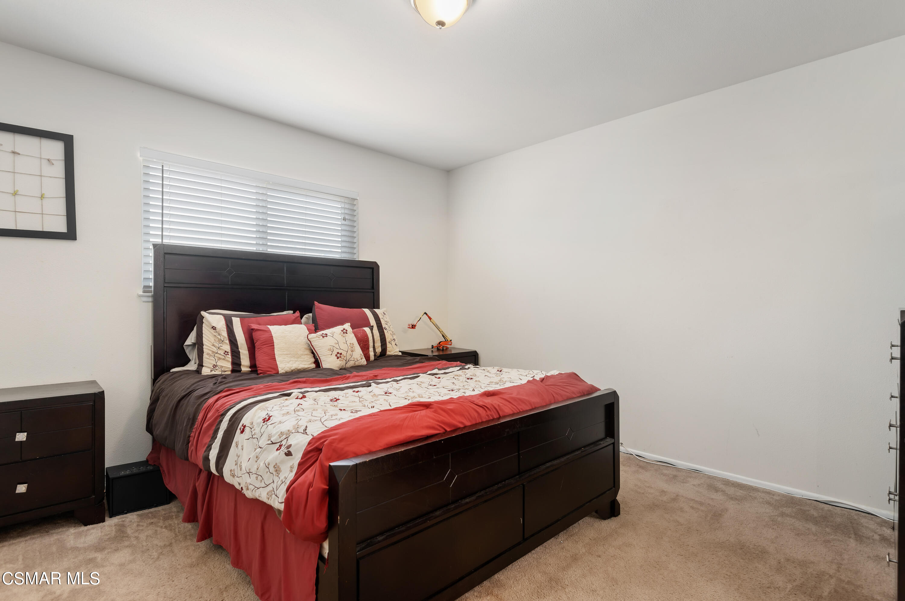 1714 Fitzgerald Road Simi Valley, CA 93065 - Photo 13 of 23 a bed sitting in a bedroom next to a window