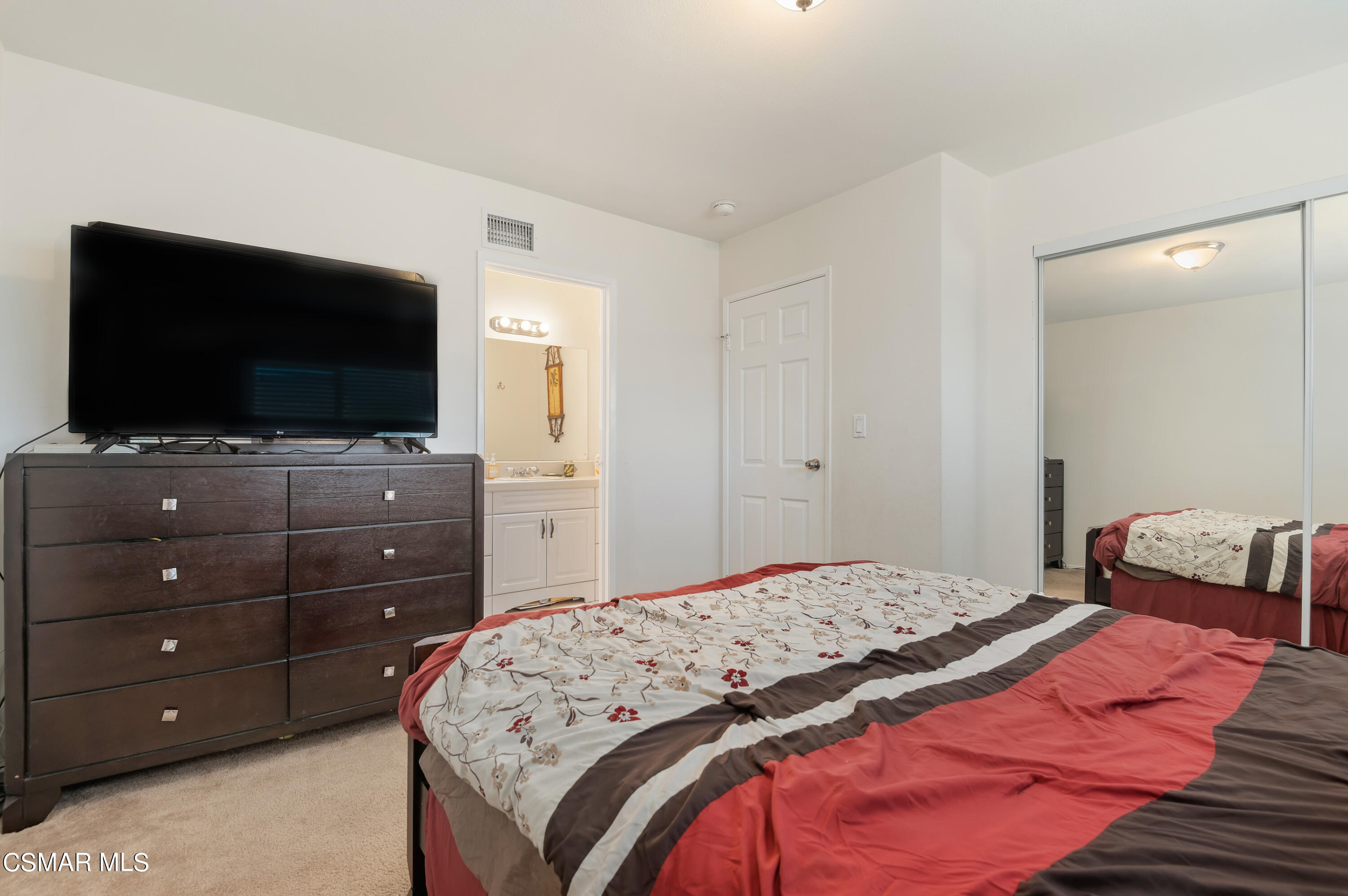 1714 Fitzgerald Road Simi Valley, CA 93065 - Photo 14 of 23 a bedroom with a bed and a flat screen tv