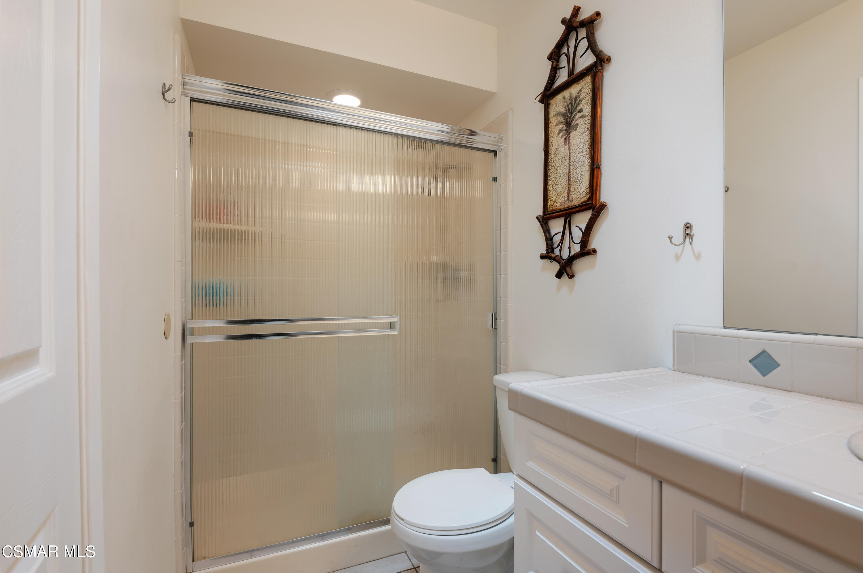 1714 Fitzgerald Road Simi Valley, CA 93065 - Photo 16 of 23 a bathroom with a granite countertop sink toilet and shower