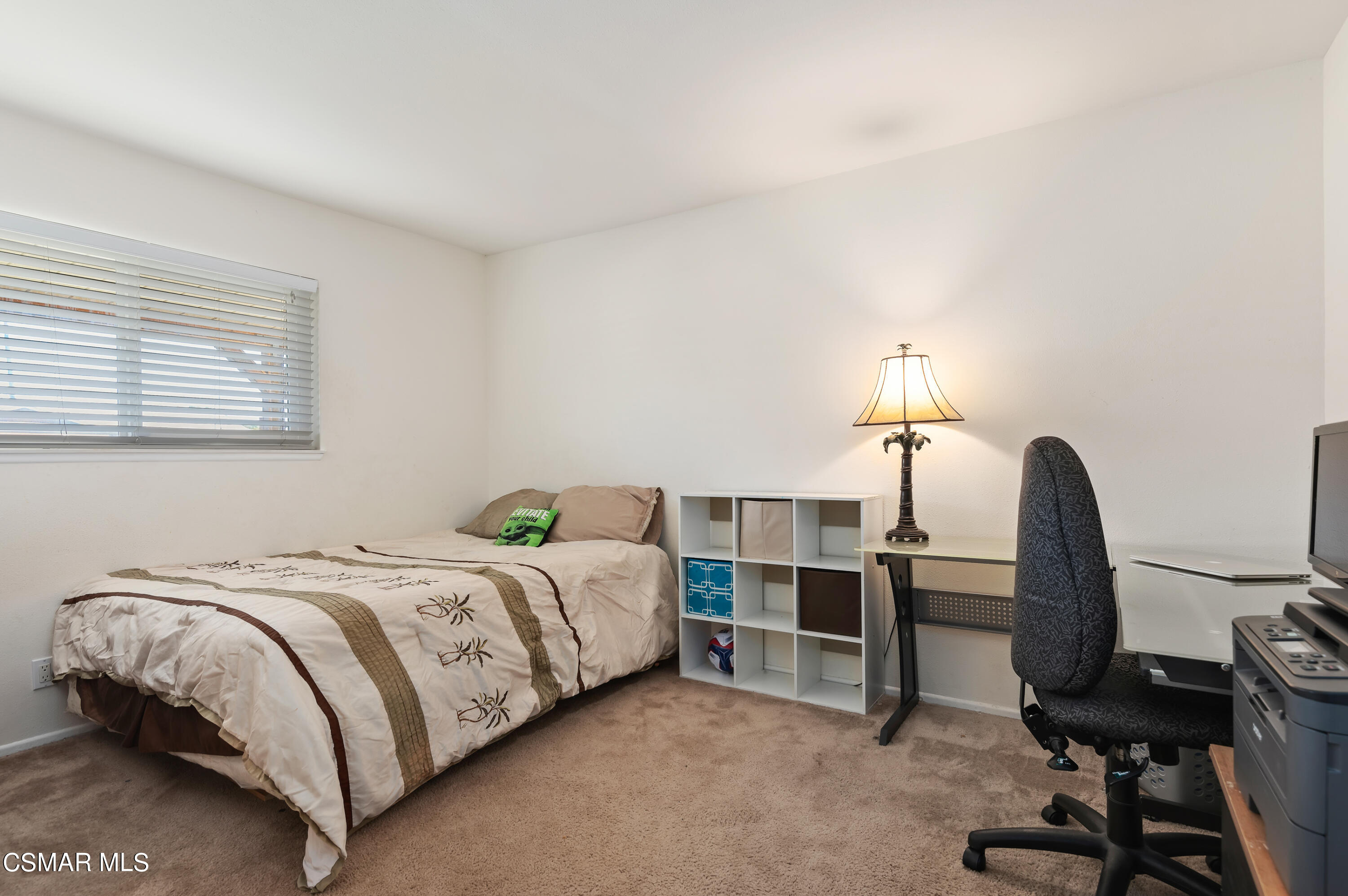 1714 Fitzgerald Road Simi Valley, CA 93065 - Photo 17 of 23 a bedroom with a bed a desk and chair