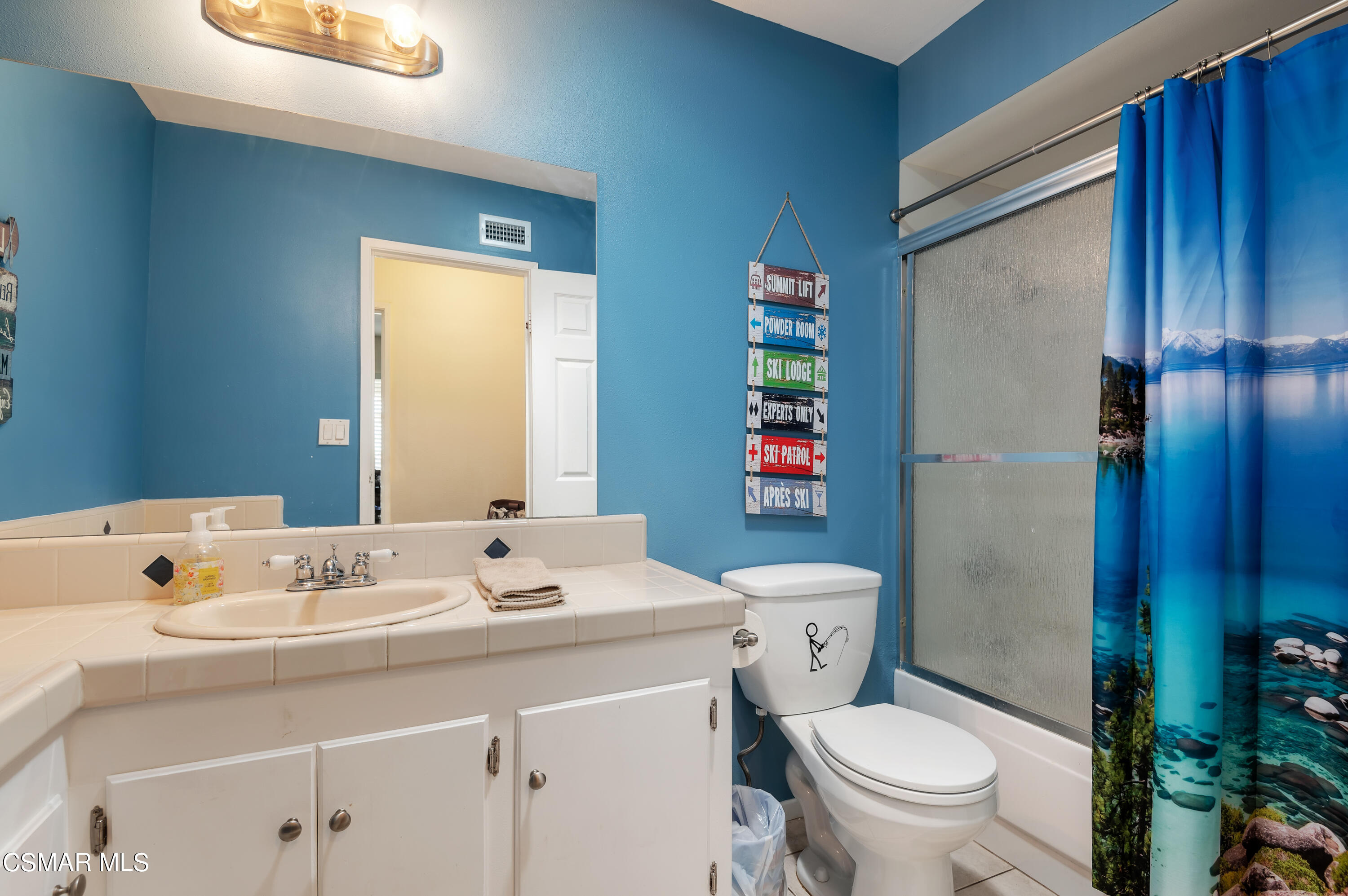 1714 Fitzgerald Road Simi Valley, CA 93065 - Photo 18 of 23 a bathroom with a sink a toilet and shower curtain