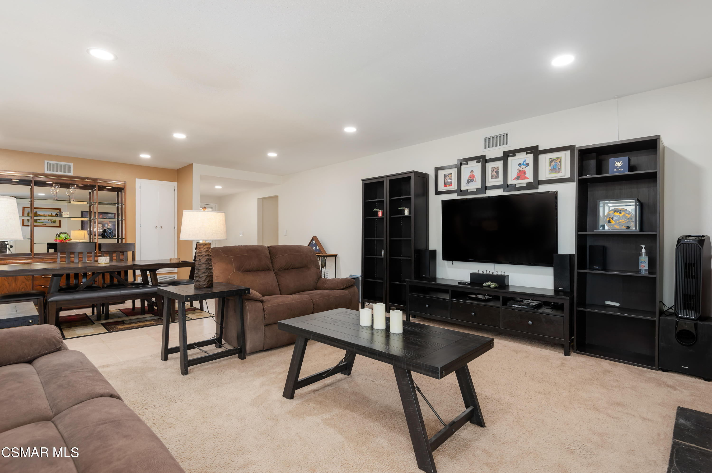 1714 Fitzgerald Road Simi Valley, CA 93065 - Photo 6 of 23 a living room with furniture and a flat screen tv