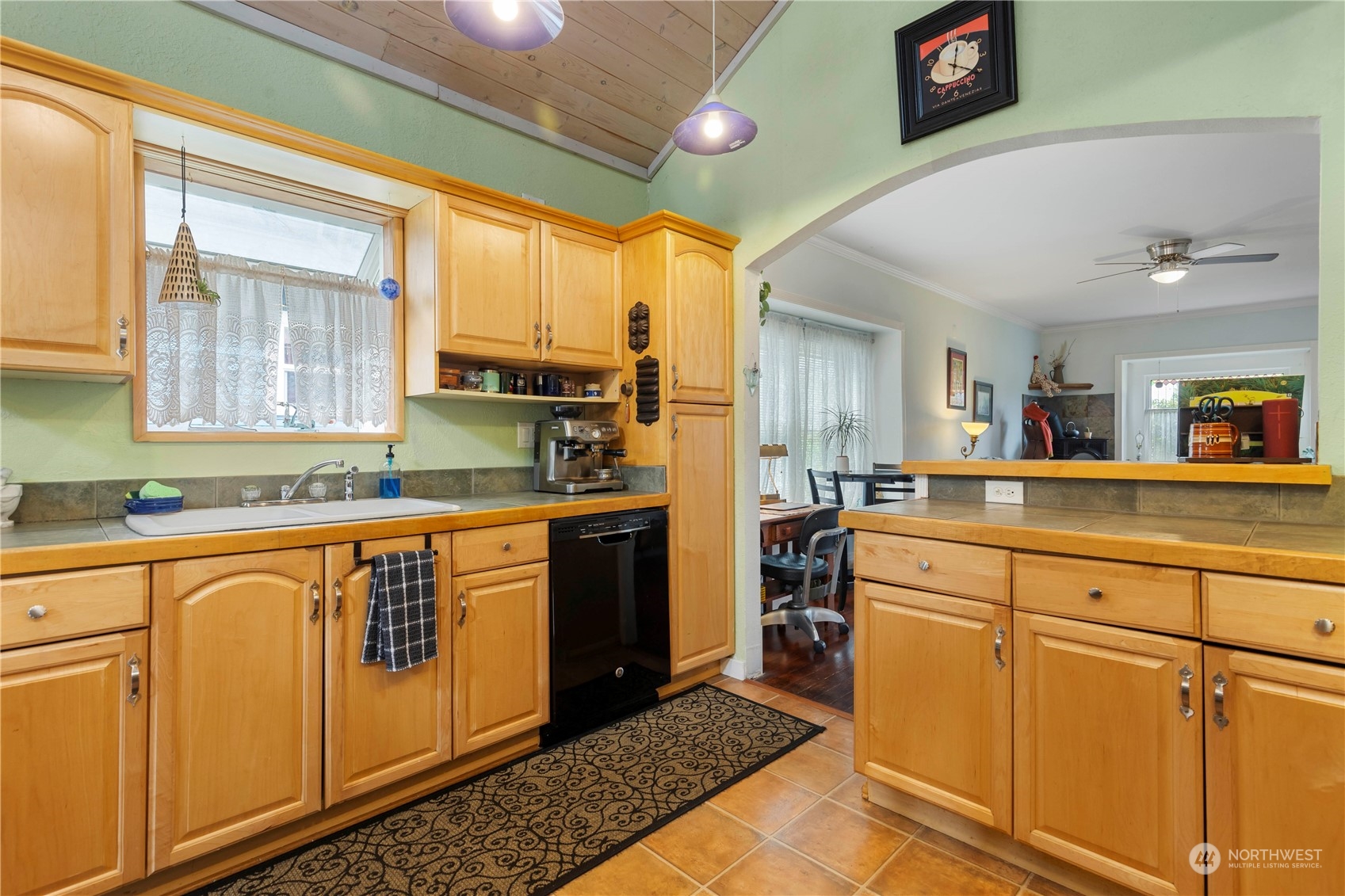 2812 19th Street Everett, WA 98201 - Photo 11 of 27 a kitchen with stainless steel appliances granite countertop a sink a stove cabinets and wooden floor