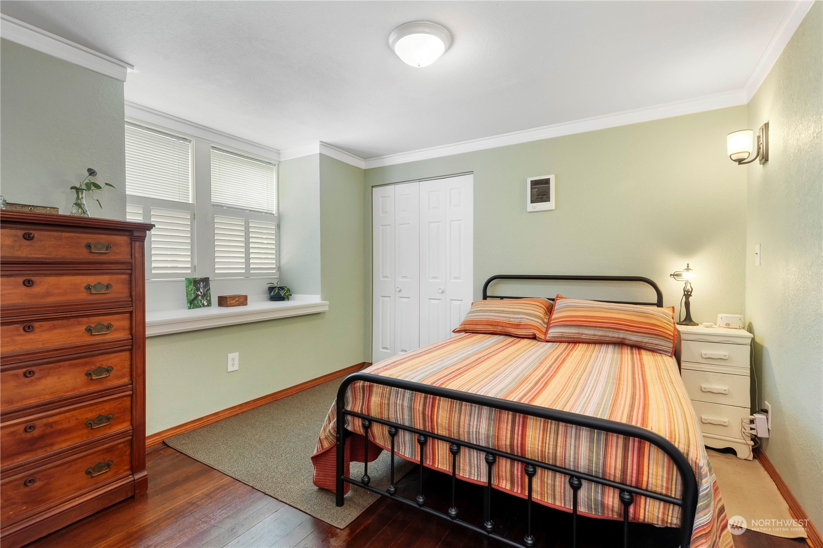 2812 19th Street Everett, WA 98201 - Photo 14 of 27 a bedroom with a bed and wooden floor