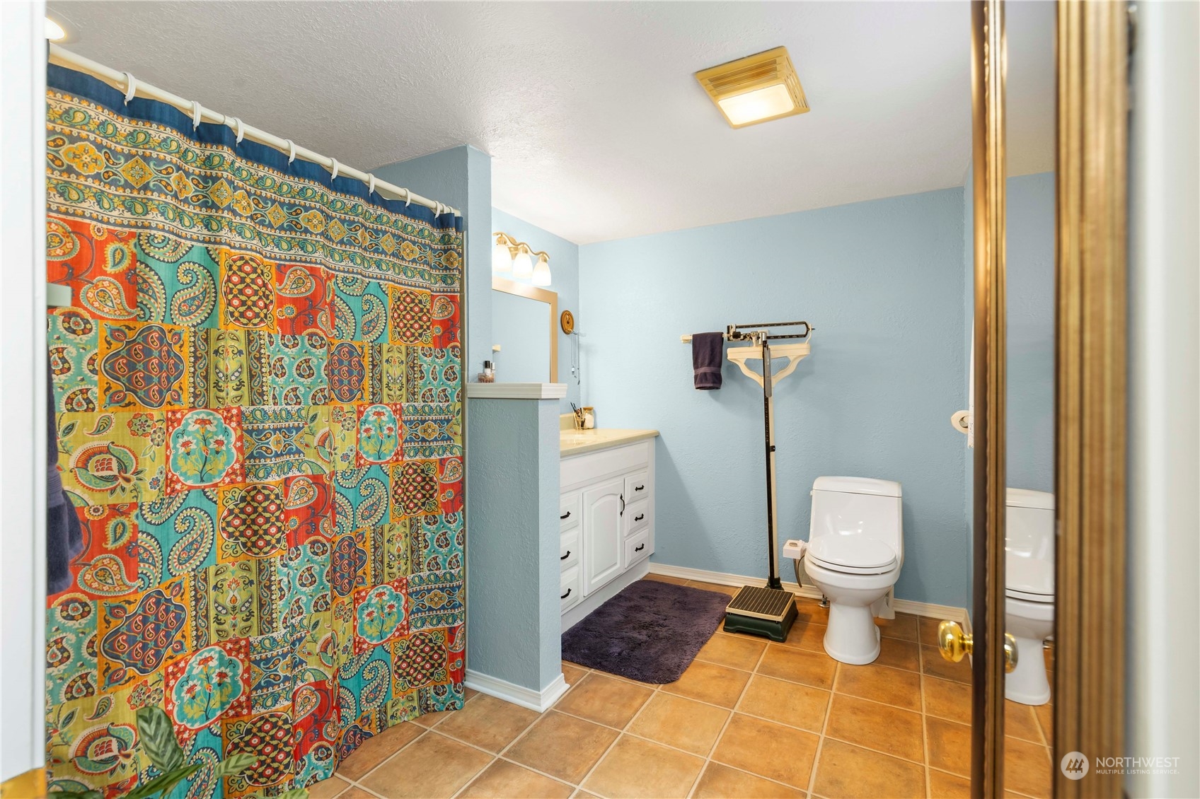 2812 19th Street Everett, WA 98201 - Photo 16 of 27 a bathroom with a toilet and a shower curtain