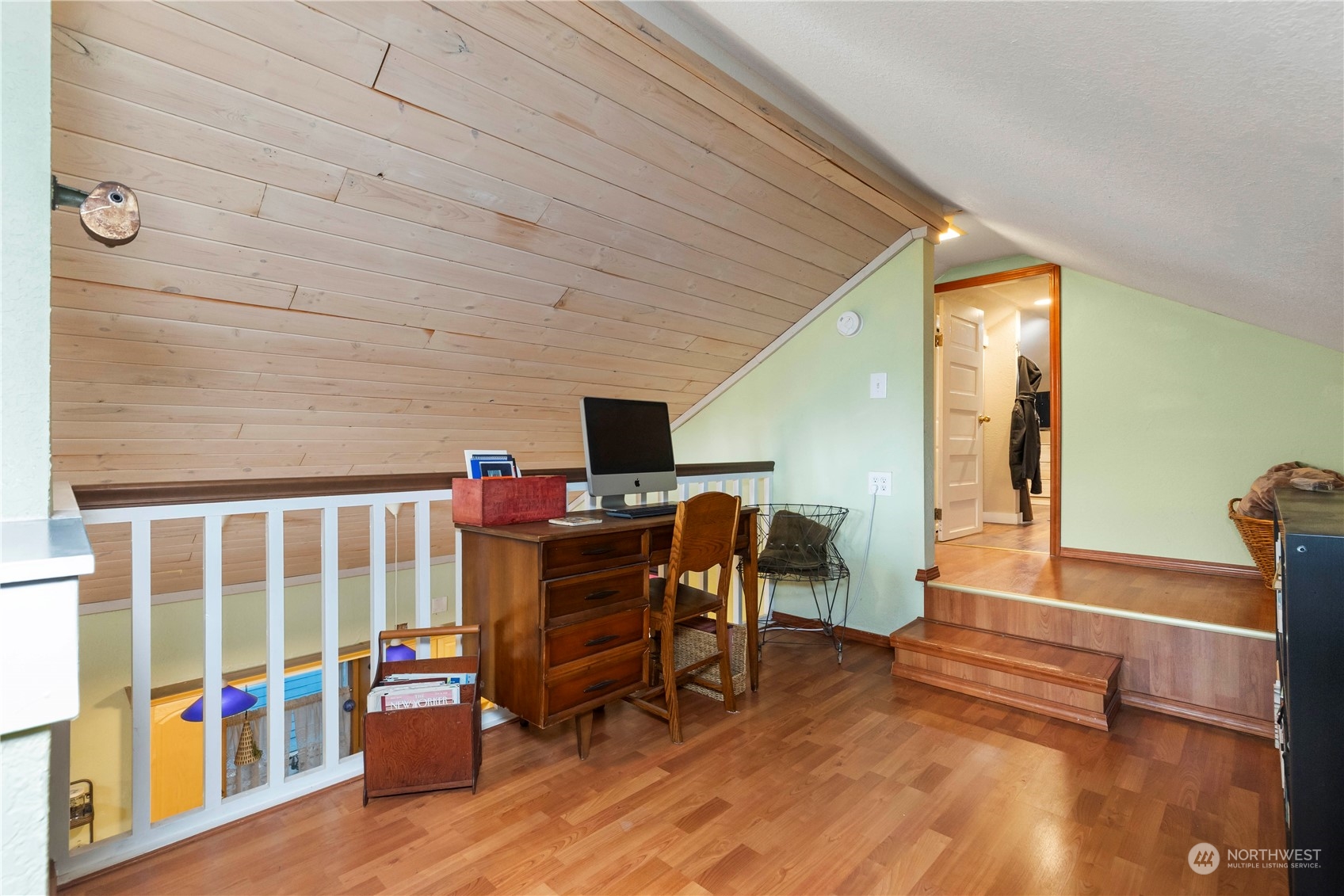 2812 19th Street Everett, WA 98201 - Photo 18 of 27 a view of a workspace with furniture window and wooden floor