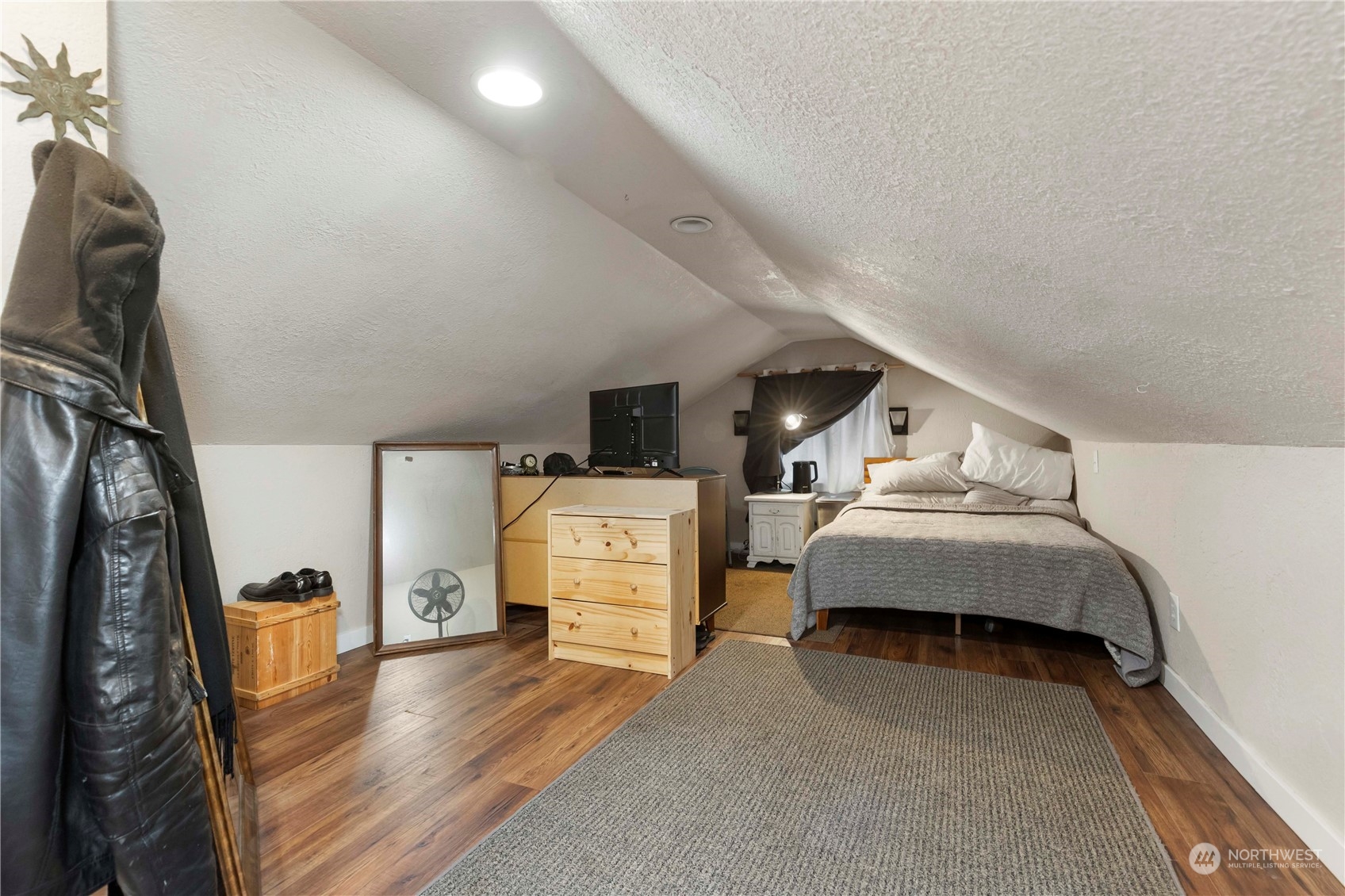 2812 19th Street Everett, WA 98201 - Photo 19 of 27 a bedroom with furniture and a wooden floor