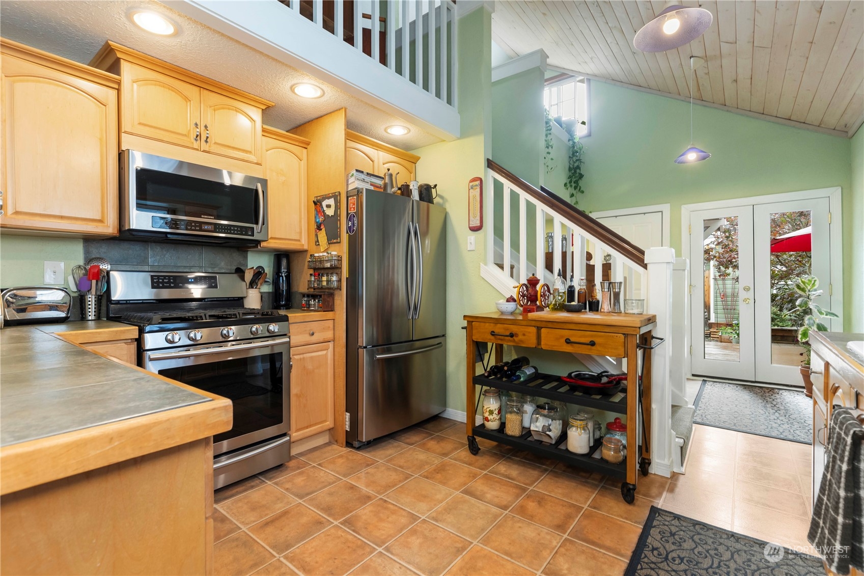 2812 19th Street Everett, WA 98201 - Photo 9 of 27 a kitchen with stainless steel appliances a stove a refrigerator and a sink