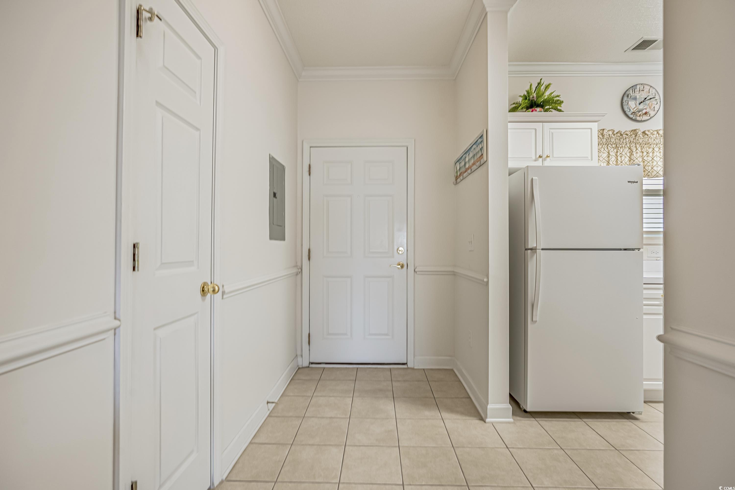 500 Wickham Drive, Unit HEATHERSTONE BUILDING 12 Myrtle Beach, SC 29579 - Photo 11 of 32 Hallway with light tile patterned floors, ornamental molding, and electric panel